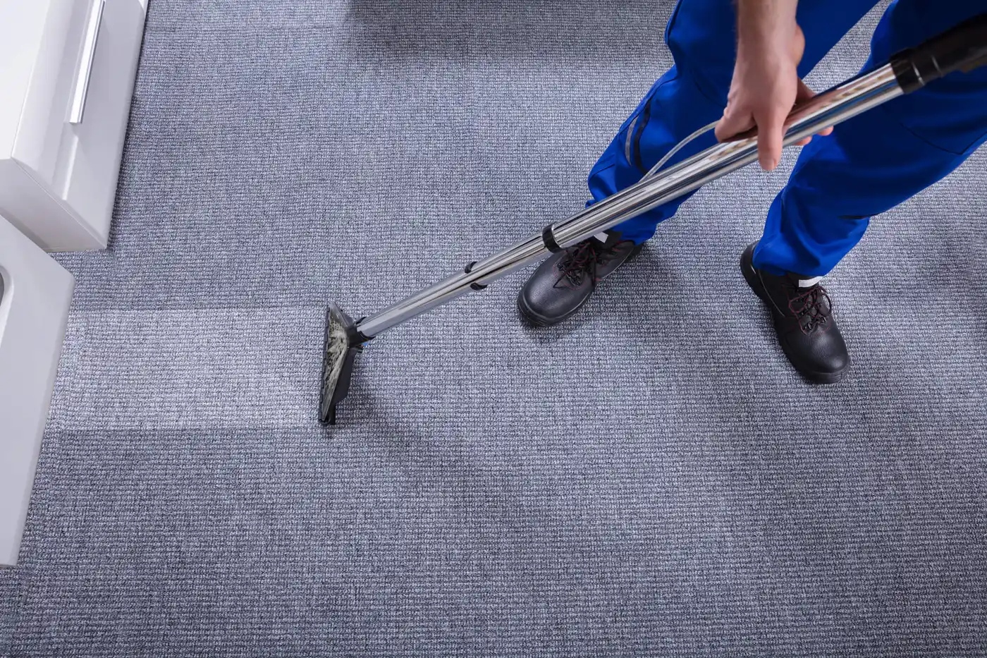 Janitor Cleaning Carpet. Janitor`s Hand Cleaning Carpet With Vacuum Cleaner