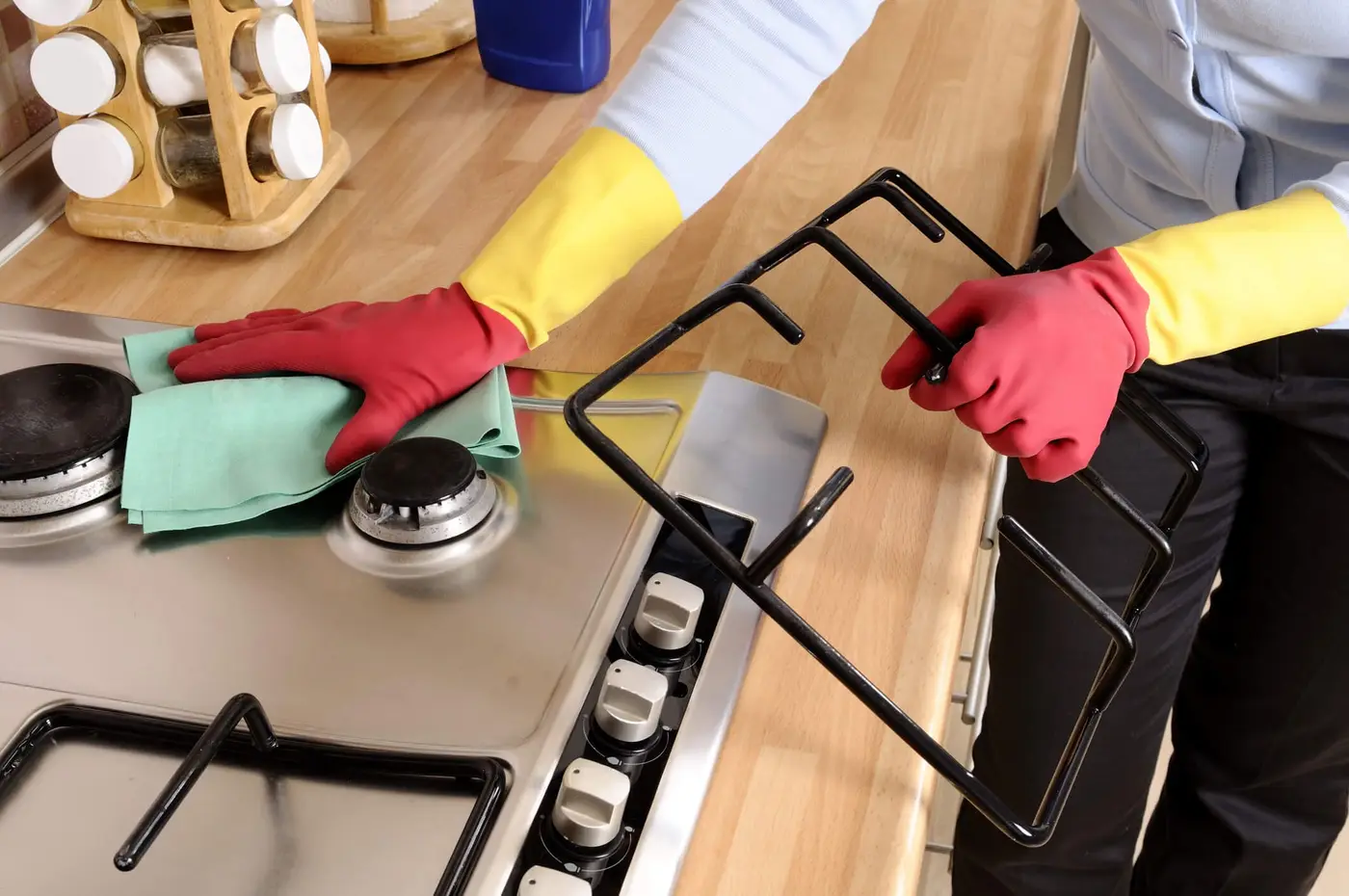 Women cleaning the house. Women cleaning the cooker. women worker.